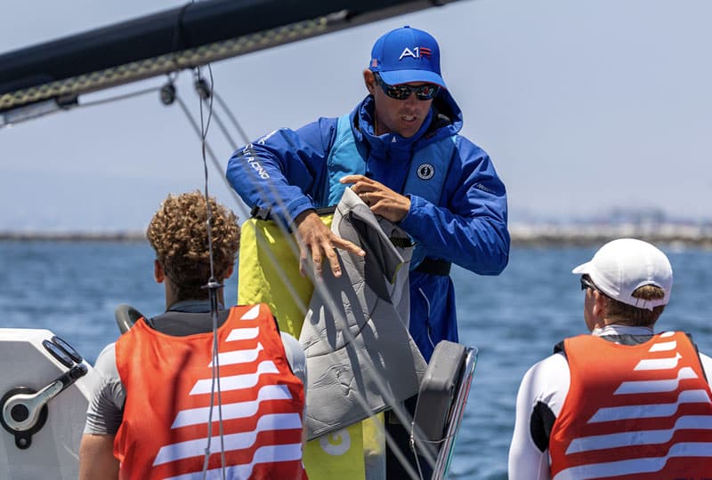 Project Podium trainer talking with athletes